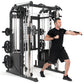Man in black shirt and shorts demonstrating Warrior 701 black and white multi-station power rack with cable crossover and smi