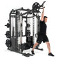 Black and white multi-station gym equipment with cable system and weight plates, demonstrated by man in black athletic wear p