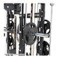 Black and silver multi-function gym machine with weight plates on chrome barbell, featuring cable crossover and smith machine