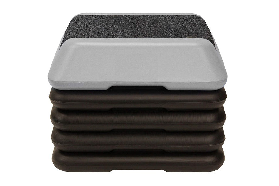 Stacked aerobic step platforms in black and gray, featuring textured tops and molded bases, on white background