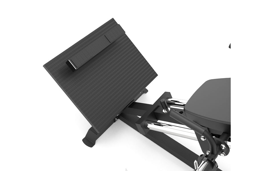 Black compact leg press machine with textured footplate and adjustable seat, angled view on white background