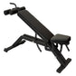 Black adjustable weight bench with leg extension attachment and padded backrest on white background