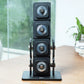 Warrior D22.5 adjustable dumbbells stacked vertically on black base with carrying handles, displayed on wooden desk