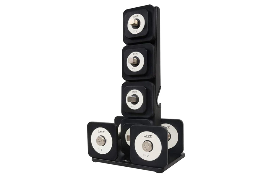 Black modular speaker system with five stacked cube-shaped units featuring cream and silver circular speaker cones, displayed