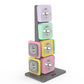 Stacked modular dumbbells in pastel colors including purple, mint green, pink, and yellow with silver switches on dark gray b