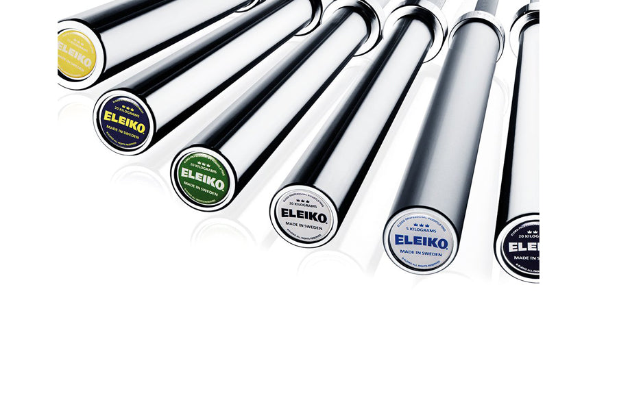 Six Eleiko powerlifting bars with black sleeves and colored end caps arranged in a row on white background