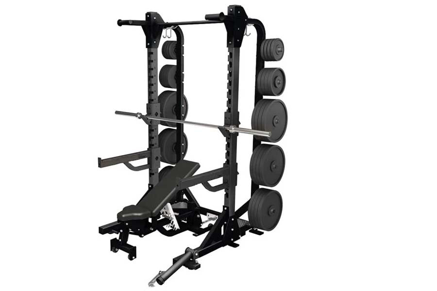 Black power rack with dual squat stations, weight plate storage on both sides, barbell, and adjustable bench on white backgro