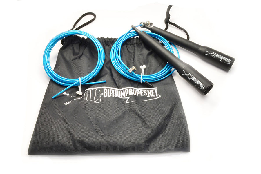 Two bright blue speed jump ropes with black handles and carrying bag on white background