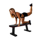 Woman performing leg lift exercise on black flat weight bench with red trim against white background
