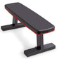 Black and red flat weight bench with padded seat, adjustable backrest, and sturdy black metal frame on white background