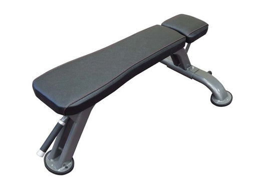Black padded flat weight bench with adjustable headrest and sturdy metal frame on white background