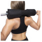 Black foam barbell squat pad with silver bar, worn by model on shoulders during weighted exercise