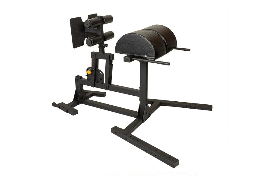 Black leg press and glute-ham developer machine with padded seat and leg attachment, on white background