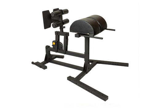 Black leg press and glute-ham developer machine with padded seat and leg attachment, on white background