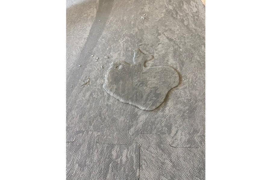 Warrior Marble Interlocking Tile in cloud grey with embossed paw print detail, flat lay view