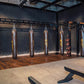 Warrior Marble Interlocking Gym Tile Flooring in pine color installed in boxing gym with heavy bags and equipment