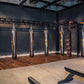 Warrior Marble Interlocking Gym Tile Flooring in sand color installed in boxing gym with heavy bags