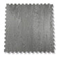 Warrior Marble Interlocking Gym Tile in smoke grey with wood grain texture and puzzle-piece edges, flat lay