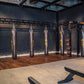 Warrior Marble Interlocking Gym Tile Flooring in smoke grey installed in boxing studio with heavy bags and equipment