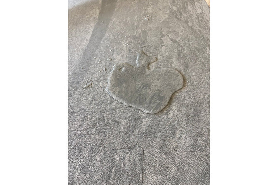 Warrior Marble Interlocking Gym Tile Flooring in taupe with embossed paw print detail, flat lay view