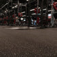 Warrior Multilayer Interlocking Rubber Gym Flooring Tiles in black with red speckle, installed in commercial gym with weightl
