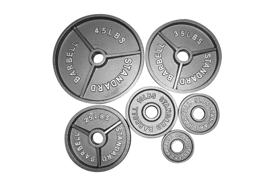 Cast iron Olympic weight plates in various sizes ranging from 10 lbs to 45 lbs, displayed on white background