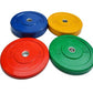 Set of four color-coded rubber bumper plates in blue, yellow, red, and green with weight markings, displayed on white backgro