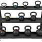 Three-tier black powder-coated kettlebell rack holding eleven kettlebells with gray handles on white background