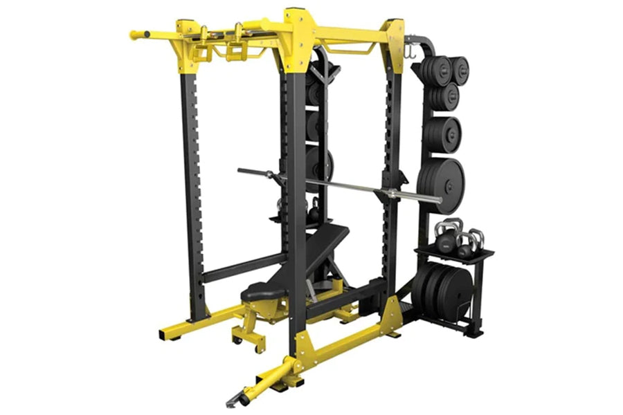 Yellow and black power rack with cable attachment, weight plate storage, and dumbbell rack on white background