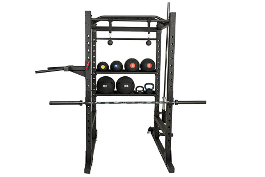 Black metal power rack with adjustable shelves holding various weights, kettlebells, and pull-up bar attachments on white bac