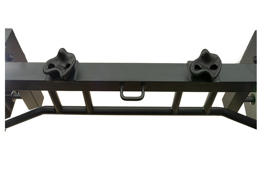 Black steel power rack top bar with dual skull-shaped safety stops and center handle, front view on white background