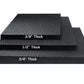 Black rubber gym floor mats in three thickness options: 3/8" thick, 1/2" thick, and 3/4" thick, stacked to show size comparis