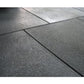 Warrior Rubber Gym Floor Mats in dark gray with textured surface and interlocking edges, flat lay view