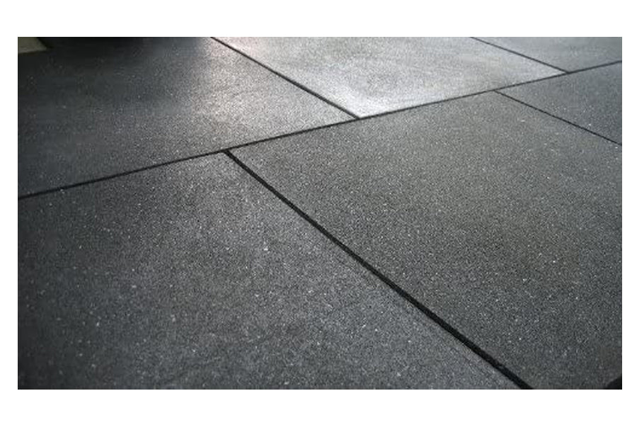 Warrior Rubber Gym Floor Mats in dark gray with textured surface and interlocking edges, flat lay view