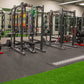 Warrior Sports Performance Turf bright green synthetic turf with gray rubber gym flooring in fitness facility with weight equ
