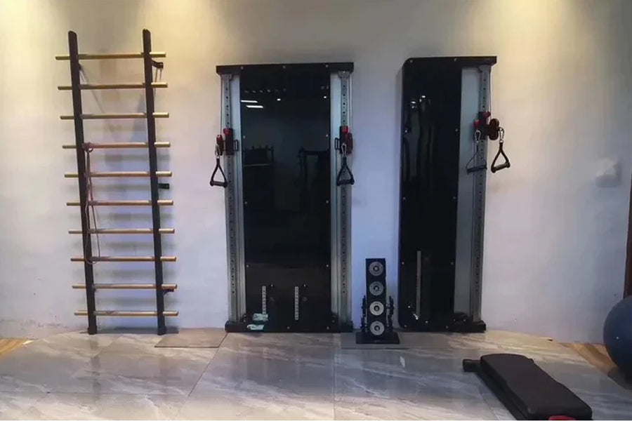 Warrior wall mounted single stack cable pulley home gym system with dark metal frame, suspension straps, and equipment mounte