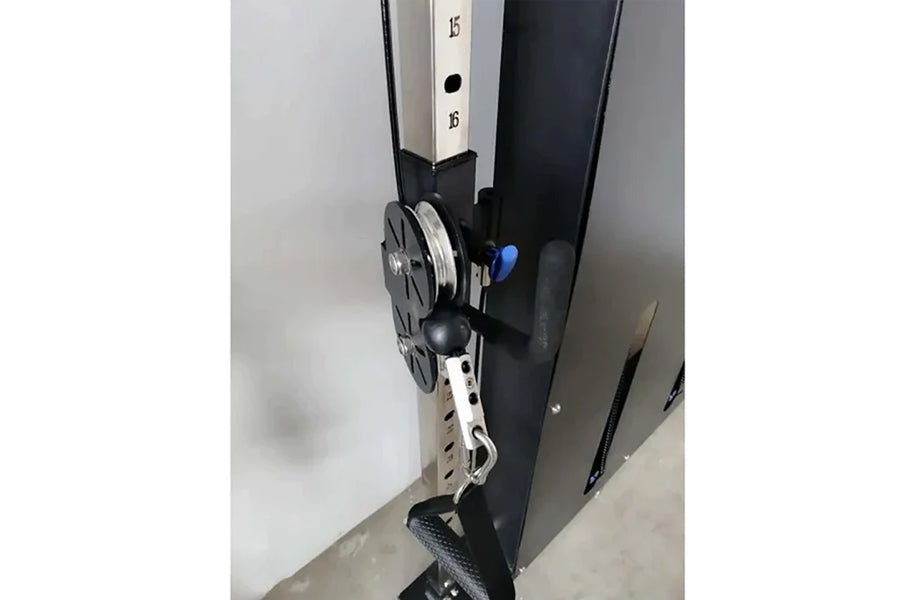 Warrior wall-mounted cable pulley home gym system with single black stack, white and black frame, and adjustable weight selec