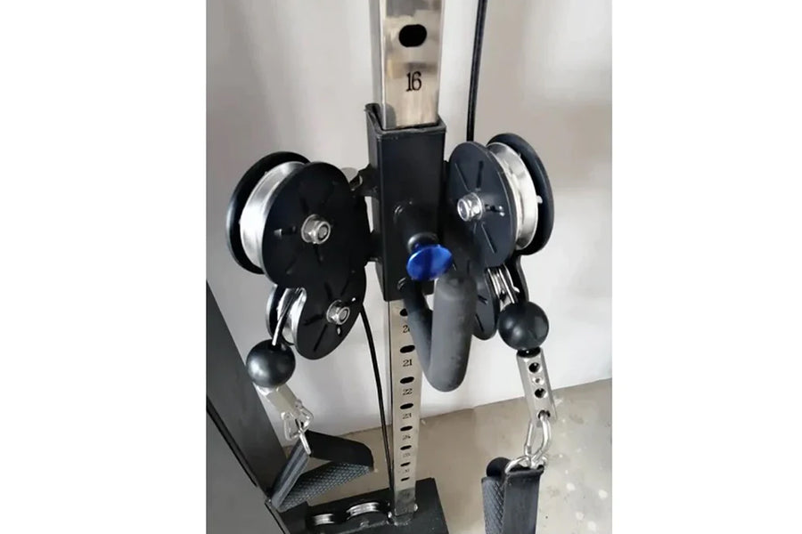 Warrior wall-mounted cable pulley home gym system with single black stack, dual pulleys, blue adjustment knob, and gray footp