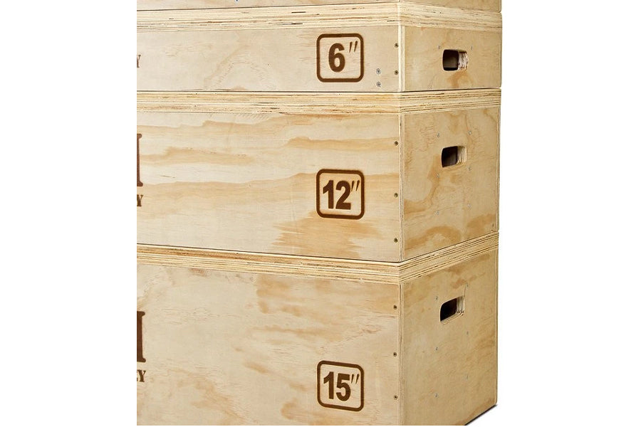 Stacked natural wood jerk blocks with labeled heights of 6 inches, 12 inches, and 15 inches, featuring handle cutouts on side