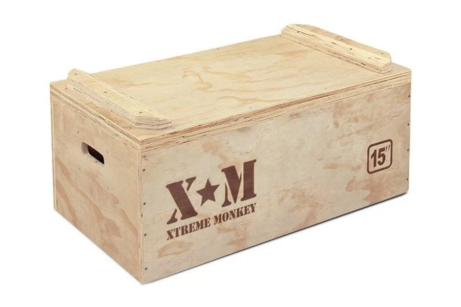 Light wood plyo box with Xtreme Monkey branding and 15-inch height marking, featuring handles on sides and flat top surface
