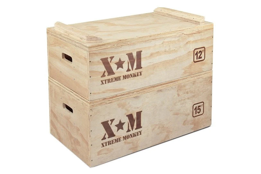 Stacked wooden plyometric boxes with "Xtreme Monkey" branding, labeled 12" and 15" heights, on white background