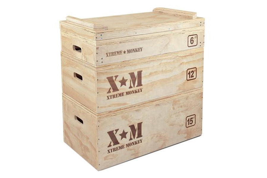 Stacked light wood plyometric training boxes with "Xtreme Monkey" branding, labeled 6", 12", and 15" heights, featuring handl