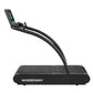 Woodway 4Front treadmill with curved black belt, arched frame, and digital display console on white background