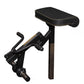 Black stationary exercise machine with padded seat and adjustable leg curl attachment on white background