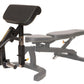 Black and gray leg curl machine attachment with padded seat and backrest, adjustable leg extension platform, and foot lever o