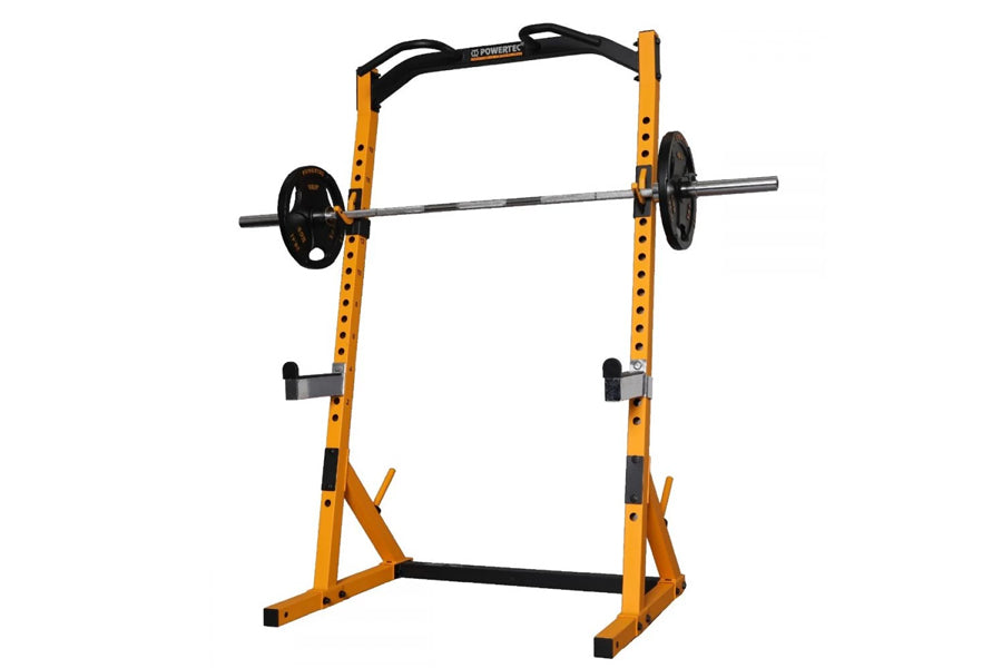 Yellow and black power squat rack with loaded barbell, adjustable safety bars, and weight plate pegs on white background
