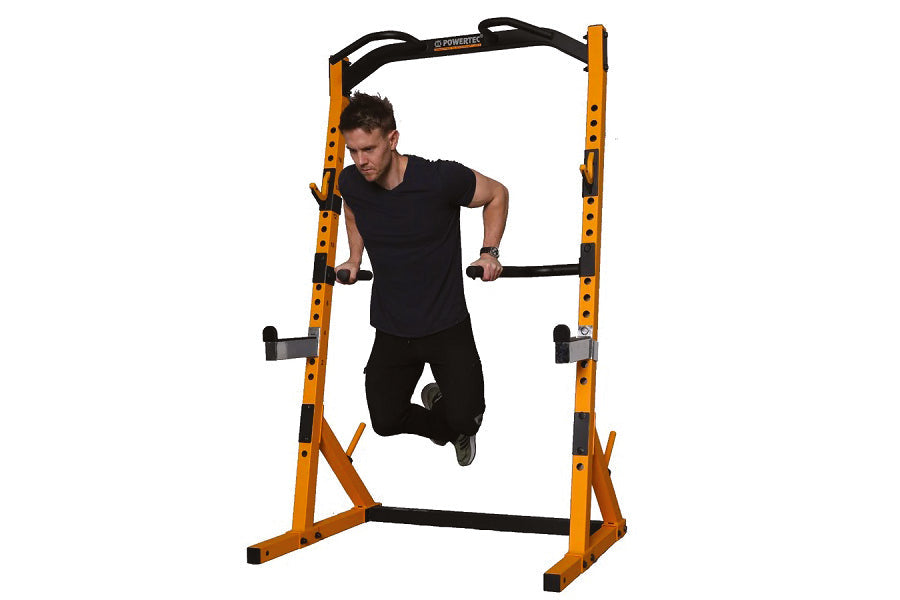 Man performing pull-up on yellow and black half rack with adjustable handles, shown on white background