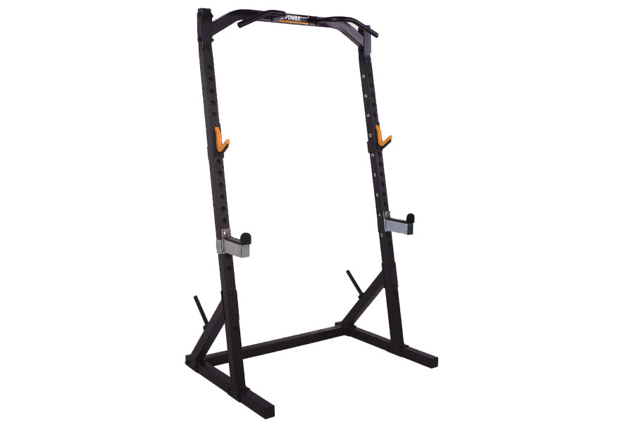 Black steel half rack with orange safety handles and adjustable spotter arms on white background