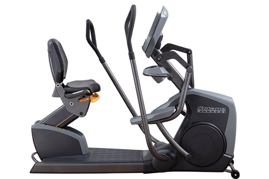 Octane XR6000 recumbent exercise bike with black frame, padded seat and backrest, dual handle bars, and foot pedals on white 