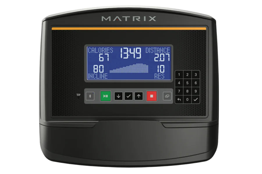 Matrix A50 Ascent Trainer console displaying blue screen with workout metrics, black textured front panel, orange accent stri